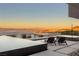 Tranquil poolside view with lounge chairs, desert landscape, and panoramic mountain vistas at sunset at 612 Dragon Mountain Ct, Henderson, NV 89012