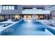 Stunning backyard pool with modern patio, lounge chairs, and seamless indoor-outdoor living at 612 Dragon Mountain Ct, Henderson, NV 89012