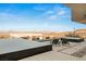 Luxury infinity pool with lounge chairs overlooking a scenic mountain and city view at 612 Dragon Mountain Ct, Henderson, NV 89012