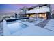 Modern backyard oasis with pool, spa, fire pit, and sleek patio design, perfect for outdoor entertaining at 612 Dragon Mountain Ct, Henderson, NV 89012