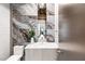 Stylish powder room featuring modern fixtures, marble accents, and a sleek vanity at 612 Dragon Mountain Ct, Henderson, NV 89012