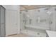 Modern bathroom featuring a glass-enclosed shower, a built-in bench, and elegant tile work at 3628 Warmbreeze Way, Las Vegas, NV 89129