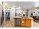 Kitchen features granite island, stainless steel dishwasher, and wood cabinets at 8405 Bonnie Blue St, Las Vegas, NV 89143