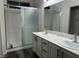 Bathroom with double vanity and walk-in shower at 5591 La Perla Ct, Las Vegas, NV 89122