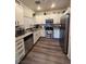 Updated kitchen featuring stainless steel appliances and light cabinets at 5591 La Perla Ct, Las Vegas, NV 89122