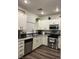 Modern kitchen with stainless steel appliances and granite countertops at 5591 La Perla Ct, Las Vegas, NV 89122