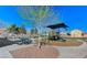 Community playground with shaded play area and picnic tables at 5591 La Perla Ct, Las Vegas, NV 89122
