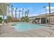 Community swimming pool with surrounding seating at 5591 La Perla Ct, Las Vegas, NV 89122