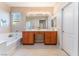 Elegant bathroom with double vanity and soaking tub at 5904 Sorto Lago St, North Las Vegas, NV 89081