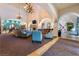 Community Lobby with comfortable seating, fireplace, and large TV at 5904 Sorto Lago St, North Las Vegas, NV 89081