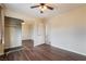 This bedroom features wood floors, closet with mirrored doors, and ceiling fan at 10332 Perfect Parsley St, Las Vegas, NV 89183