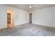 Bright bedroom with ceiling fan and doors leading to an en-suite bathroom and walk-in closet at 10332 Perfect Parsley St, Las Vegas, NV 89183