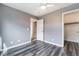 This bedroom features wood floors, neutral walls, and a closet with sliding doors at 10332 Perfect Parsley St, Las Vegas, NV 89183