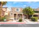 Charming two-story home featuring a stucco facade, well-maintained landscaping, and covered entry at 10332 Perfect Parsley St, Las Vegas, NV 89183