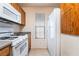 Bright kitchen featuring white appliances, including a range, microwave, and refrigerator at 10332 Perfect Parsley St, Las Vegas, NV 89183