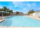 Community pool with clear blue water, lounge area, and views of neighborhood at 10332 Perfect Parsley St, Las Vegas, NV 89183
