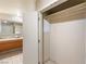 Bathroom featuring double sinks with access to closet at 211 E Flamingo Rd # 610, Las Vegas, NV 89169