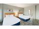 Bright bedroom featuring two beds and soft, neutral decor at 211 E Flamingo Rd # 610, Las Vegas, NV 89169