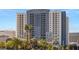 Platinum Hotel exterior view with palm trees under a blue sky at 211 E Flamingo Rd # 610, Las Vegas, NV 89169