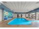 Bright indoor pool area featuring a 'Welcome to Las Vegas' mural and comfortable seating area at 211 E Flamingo Rd # 610, Las Vegas, NV 89169