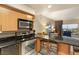 View of the kitchen with stainless steel appliances and a breakfast bar overlooking the living area at 211 E Flamingo Rd # 610, Las Vegas, NV 89169