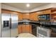Close up of the kitchen with stainless steel appliances and black countertops at 211 E Flamingo Rd # 610, Las Vegas, NV 89169