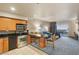 Kitchen with stainless appliances that opens to a living room with a balcony and city views at 211 E Flamingo Rd # 610, Las Vegas, NV 89169