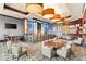 Upscale lounge area with bar, chairs, and modern lighting at 211 E Flamingo Rd # 610, Las Vegas, NV 89169