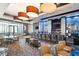 Upscale lounge area with bar, chairs, and modern lighting fixtures at 211 E Flamingo Rd # 610, Las Vegas, NV 89169