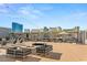 Luxury rooftop deck offering lounge seating, a fire pit, and stunning views of the cityscape at 211 E Flamingo Rd # 610, Las Vegas, NV 89169