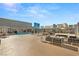 Beautiful rooftop deck featuring a pool, lounge chairs, fire pit, and views of the city skyline at 211 E Flamingo Rd # 610, Las Vegas, NV 89169