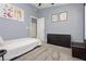 Cozy bedroom with neutral walls, ceiling fan, dresser and decor with natural light from doorway at 3576 Judah Way, Las Vegas, NV 89147