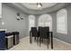 Cozy dining area featuring elegant windows, modern light fixture, and seating for four at 3576 Judah Way, Las Vegas, NV 89147