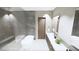 Modern bathroom featuring a glass walk-in shower, freestanding tub, and sleek design elements at 491 Cityview Ridge Dr, Henderson, NV 89012