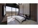 Staged bedroom with floor to ceiling windows, neutral color palette, and modern design elements at 491 Cityview Ridge Dr, Henderson, NV 89012