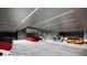 Showcasing a modern garage design, featuring a collection of luxury vehicles and a sleek, well-lit interior at 491 Cityview Ridge Dr, Henderson, NV 89012