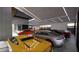 Showcasing a modern garage featuring an array of luxury sports cars and sleek, contemporary lighting at 491 Cityview Ridge Dr, Henderson, NV 89012