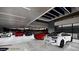 A modern, well-lit garage featuring a variety of luxury vehicles, highlighting the home's upscale amenities at 491 Cityview Ridge Dr, Henderson, NV 89012