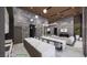 Open living space with a fireplace and view of the expansive kitchen area with dual islands at 491 Cityview Ridge Dr, Henderson, NV 89012