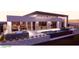 Stunning rear exterior featuring a pool, modern design, ample lounge space, and garage for car collectors at 491 Cityview Ridge Dr, Henderson, NV 89012