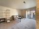 Spacious living room with large windows and access to a balcony at 5160 Indian River Dr # 346, Las Vegas, NV 89103