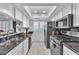 Modern kitchen with white cabinets and granite countertops at 5330 Duralite St # 102, Las Vegas, NV 89122