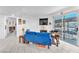 Living room with blue sofa and access to balcony at 5330 Duralite St # 102, Las Vegas, NV 89122