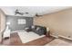 Living room with hardwood floors, sectional sofa, and ceiling fans at 5905 Paseo Montana, Las Vegas, NV 89108