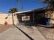 Property exterior featuring gated parking and landscaping at 1504 E Mcwilliams Ave, Las Vegas, NV 89101