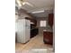 Efficient kitchen featuring wood cabinets and tile flooring at 1504 E Mcwilliams Ave, Las Vegas, NV 89101