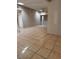 Large living area with tile floors and access to other rooms at 1504 E Mcwilliams Ave, Las Vegas, NV 89101