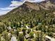 Aerial view of a neighborhood surrounded by mountains and trees, offering a peaceful atmosphere and scenic views at 3968 Mont Blanc Way, Las Vegas, NV 89124