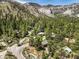 Aerial view of homes situated in a mountainous area with lush vegetation, providing a tranquil and serene environment at 3968 Mont Blanc Way, Las Vegas, NV 89124