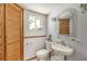 Small bathroom with pedestal sink, toilet and shower at 3968 Mont Blanc Way, Las Vegas, NV 89124